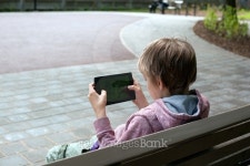 Boy with a Tablet PC in the park 이미지 (479100358) - 게티이미지뱅크 Boy with a Tablet PC in the park