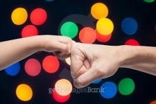 father and son punching fists for agreement on christmas lights 이미지 (476255108) - 게티이미지뱅크 father and son punching... 