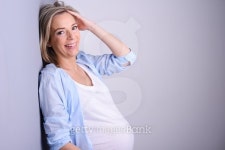 beautiful blonde mature pregnant woman blue shirt isolated gray background 이미지 (538322681) - 게티이미지뱅크 beautiful... 