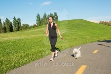 Beautiful young woman jogging with her dog 이미지 (497660386) - 게티이미지뱅크 Beautiful young woman jogging with her dog