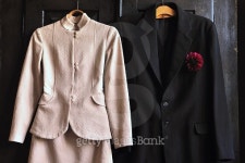 Vintage woman and man suits on the wooden black  wardrobe 이미지 (492071880) - 게티이미지뱅크 Vintage woman and man suits on... 