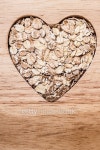 Oat cereal heart shaped on wooden surface. 이미지 (475684930) - 게티이미지뱅크 Oat cereal heart shaped on wooden surface.