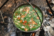 Preparing food on campfire 이미지 (477384988) - 게티이미지뱅크 Preparing food on campfire