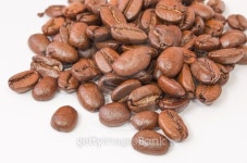 Handful of freshly roasted coffee beans on white 이미지... 게티이미지뱅크 Handful of freshly roasted coffee beans on white