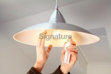 Person changing bulbs to save energy 이미지 (466531890) - 게티이미지뱅크 Person changing bulbs to save energy