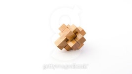 Wooden blocks of intricate puzzle. Isolated on white backgro...