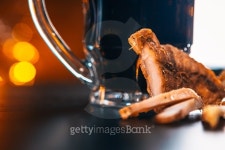 glass of fresh beer and dried  chicken on wooden table 이미지... glass of fresh beer and dried  chicken on wooden table