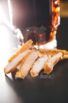 glass of fresh beer and dried  chicken on wooden table 이미지... glass of fresh beer and dried  chicken on wooden table