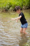 Young Asian girl playing in the river 이미지 (487977392) - 게티이미지뱅크 Young Asian girl playing in the river