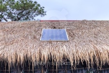 Solar cell on thatched roof for energy in forest. 이미지 (504251308) - 게티이미지뱅크 Solar cell on thatched roof for energy... 
