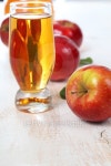Apple juice and apples on a  wooden table 이미지 (503364086) - 게티이미지뱅크 Apple juice and apples on a  wooden table