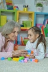 Grandmother with granddaughter playing together 이미지 (503395932) - 게티이미지뱅크 Grandmother with granddaughter playing... 