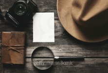 Photo camera, notebook, hat, magnifier, paper on black table 이미지 (509861170) - 게티이미지뱅크 Photo camera, notebook, hat... 