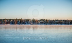 Frozen lake with forest in backgound 이미지 (503898282) - 게티이미지뱅크 Frozen lake with forest in backgound