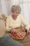 Grandmother and granddaughter playing checkers 이미지 (78436598) - 게티이미지뱅크 Grandmother and granddaughter playing checkers