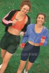 Women jogging with dumbbells outdoors 이미지 (78493845) - 게티이미지뱅크 Women jogging with dumbbells outdoors