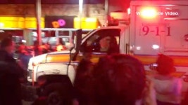 Ambulance Leaves Site of Captured Bombing Suspect