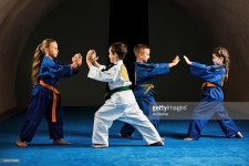 Fighting Stance Stock Photo | Getty Images Four children in a fighting stance on a sports training.
