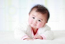 Asia Baby Is Playing On The Bed stock photo 517937834 | iStock Cute Asian baby