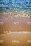 푸른 바다와 금빛 모래 해변 스톡 사진 176097974 | iStock Colourful beach scene with surf lapping on golden sands. Narrow depth...