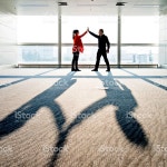제공하여 하이파이브 스톡 사진 489986328 | iStock Two People giving a high five in modern office building.
