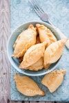리틀 파이 스톡 사진 471230486 | iStock Cornish Pasty - Baked pasty filled with brie cheese in a blue bowl