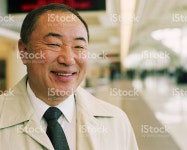 Mature Businessman In Airport Smiling stock photo 200177073-002 | iStock Mature businessman in airport, smiling