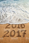 New Year 2017 stock photo 542560826 | iStock New year 2017 and old year 2016 written on sandy beach with waves
