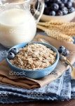 Rolled Oats In A Bowl stock photo 517360677 | iStock Rolled oats in a blue bowl with berries and milk