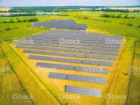 태양광 발전소 스톡 사진 516606636 | iStock Aerial view to solar power plant in corn fields. Industrial...