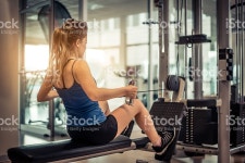Woman Training In A Gym stock photo 522870780 | iStock Woman training her back and shoulder with weight machine in a gym