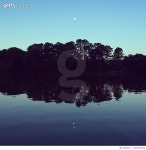 640939538 | 게티이미지코리아 | Moonrise over Trees and Water Royalty-Free 이미지