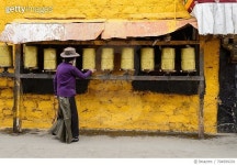 704999201 | 게티이미지코리아 | Woman Praying at Prayer Wheel Rights-Managed 이미지