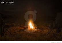 685023441 | 게티이미지코리아 | Two camp chairs around fire at night Royalty-Free 이미지