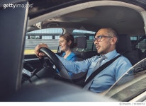 653809712 | 게티이미지코리아 | Happy business colleagues traveling together by car. Royalty-Free 이미지