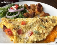 705178799 | 게티이미지코리아 | Close-Up Of Bacon Omelet With Prepared Potato And Leaf Vegetable Served In Plate On Table Royalty... 