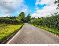 705243357 | 게티이미지코리아 | Road Passing Through Field Against Cloudy Sky Royalty-Free 이미지