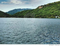 705271463 | 게티이미지코리아 | Scenic View Of River In Front Of Mountains Against Cloudy Sky Royalty-Free 이미지