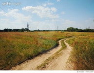 705313097 | 게티이미지코리아 | Dirt Road Passing Through Field Royalty-Free 이미지