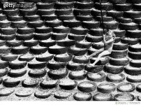 한국타이어용진밧줄 | 707555679 | 게티이미지코리아 | Full Length Of Girl Swinging On Rope Against Stack Of Tires Royalty-Free 이미지