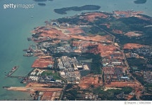 658029894 | 게티이미지코리아 | Factory area in Batam Island in Indonesia aerial view from airplane Royalty-Free 이미지