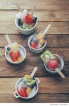 709130773 | 게티이미지코리아 | Bowls of fruit ice lollies with fresh fruits on white ground Royalty-Free 이미지