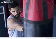 667495912 | 게티이미지코리아 | Boxer striking the punching bag at gym Royalty-Free 이미지