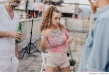 667831494 | 게티이미지코리아 | Charming girl dancing on the party on the roof Royalty-Free 이미지