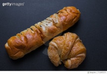 713855371 | 게티이미지코리아 | High Angle View Of Bread And Croissant Against Black Background Royalty-Free 이미지