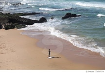 713875701 | 게티이미지코리아 | High Angle View Of Surfer Standing By Surfboard On Shore At Beach Royalty-Free 이미지
