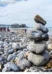 717243043 | 게티이미지코리아 | Stack Of Stones At Beach Against Cloudy Sky Royalty-Free 이미지