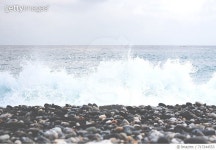 717244553 | 게티이미지코리아 | Waves Splashing On Rocks At Shore Against Clear Sky Royalty-Free 이미지