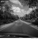 717329357 | 게티이미지코리아 | Wet Road By Trees Against Sky Royalty-Free 이미지