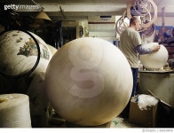 656335876 | 게티이미지코리아 | Male globe maker sanding sphere in workshop Rights-Managed 이미지